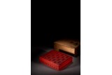 A CINNABAR LACQUER 'WAN' BOX AND COVER 