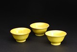 A GROUP OF THREE CHINESE YELLOW GLAZED CUPS