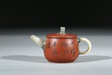 A YIXING INSCRIBED TEAPOT
