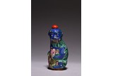 A FAMILLE ROSE 'BUDDHIST LIONS' SNUFF BOTTLE