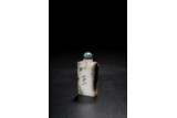 A CHINESE WHITE AND RUSSET JADE SNUFF BOTTLE