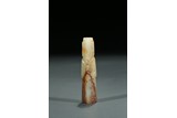 A CELADON AND RUSSET JADE FIGURE CARVING