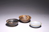 A GROUP OF THREE EARTHENWARE BOWLS