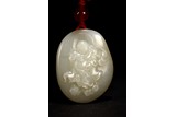 A CHINESE WHITE JADE 'LIU HAI' PENDANT