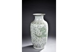 A GREEN GLAZED WHITE GROUND VASE