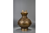 A CHINESE GILT BRONZE HU VASE WITH COVER 