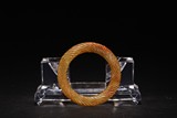 A CHINESE YELLOW JADE 'ROPE-TWIST' BANGLE