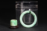 A GROUP OF TWO JADEITE BANGLE AND ARCHER'S RING