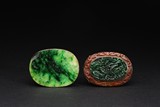 A GROUP OF TWO JADEITE AND DYED ORGANIC BROOCHES