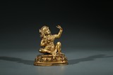 A TIBETAN GILT BRONZE FIGURE OF MAHASIDDHA VIRUPA