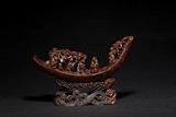 A BAMBOO CARVING OF FIGURES ON RAFT 
