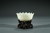 A CHINESE WHITE JADE LOTUS BOWL WITH STAND