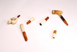 A SET OF 6 AMBER CIGARETTE HOLDERS