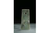 A GREEN JADE CARVED AXE BLADE