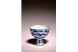 A CHINESE BLUE AND WHITE FIGURAL STEM CUP