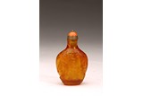 A CHINESE AMBER CARVED SNUFF BOTTLE