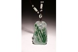 A CHINESE GREEN AND ICY JADEITE PLAQUE