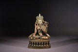A TIBETAN SILVER FIGURE OF WHITE TARA