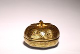 A GILT PAINTED LACQUER MELON BOX AND COVER