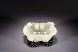 A CHINESE WHITE JADE 'RUYI AND CHI DRAGON' WASHER