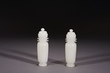 A PAIR OF WHITE JADE VASES AND COVERS