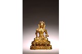 A GILT BRONZE FIGURE OF SEATED VAJRASATTVA