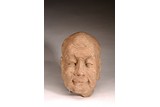 A STONE CARVED HEAD OF LUOHAN