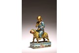 A CHINESE CLOISONNE ENAMEL FIGURE OF MONK ON TIGER