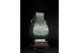 A CHINESE SPINACH GREEN JADE CARVED HU VASE