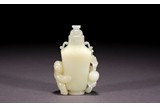 A CHINESE WHITE JADE CARVED 'BOY'S VASE