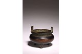 A CHINESE BRONZE TRIPOD CENSER