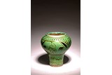 A CHINESE CIZHOU GREEN GLAZED 'BOY' JAR