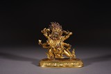 A GILT BRONZE FIGURE OF STANDING MAHAKALA