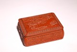 A CHINESE RED LACQUERED LANDSCAPE BOX AND COVER