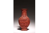 A CINNABAR LACQUER 'FIGURES' VASE