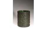 A CHINESE SPINACH GREEN JADE 'DRAGON' BRUSHPOT