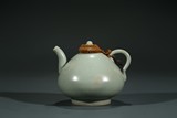 A CHINESE CELADON GLAZED TEAPOT