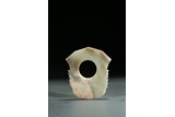 A JADE CARVED AXE BLADE