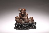 A CHINESE CHENGXIANGMU CARVED TIGER TAMING ARHAT