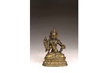 A GILT BRONZE FIGURE OF TARA