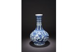 A CHINESE BLUE AND WHITE 'DRAGON THROUGH FLOWERS' VASE