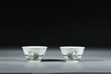 A CHINESE PAIR OF FAMILLE ROSE 'BOYS' CUPS