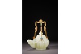 A CHINESE WHITE JADE CARVED 'RAM' MELON EWER