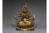 A LARGE GILT BRONZE FIGURE OF GUHYASAMAJA 