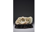 A CHINESE WHITE JADE 'ELDERLY FIGURES' MOUNTAIN BOULDER