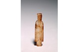 A CHINESE ARCHAIC JADE FIGURE OF AN OFFICIAL
