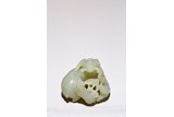 A CHINESE CELADON JADE 'THREE RAMS' CARVING