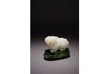 A CHINESE WHITE JADE MYTHICAL BEAST 