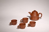 A SET OF CHINESE YIXING TEAPOT AND CUPS