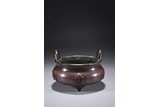 A CHINESE BRONZE 'SANSKRIT' TRIPOD CENSER